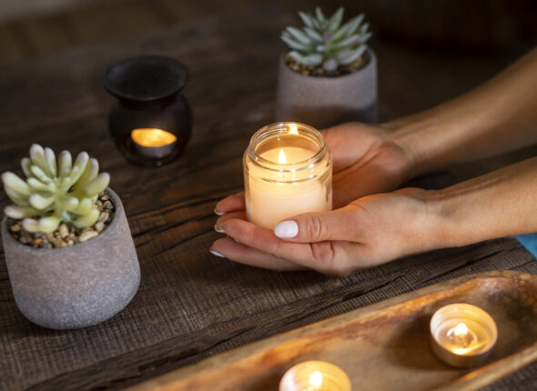 high-angle-woman-holding-candle